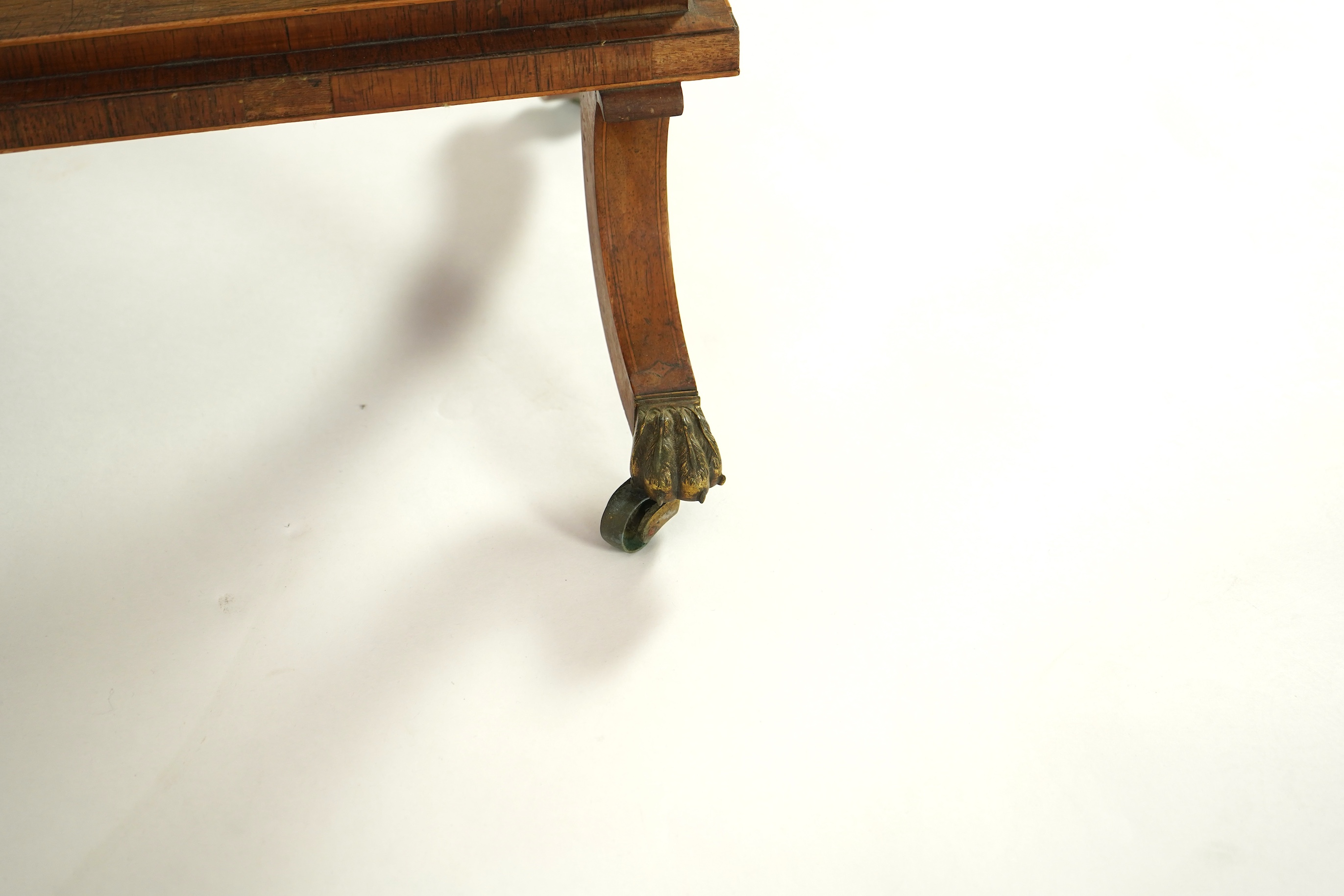 A Regency brass mounted rosewood writing, games and work table
